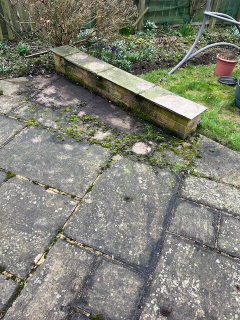 stone-patio-garden-wall-before-pressure-washing